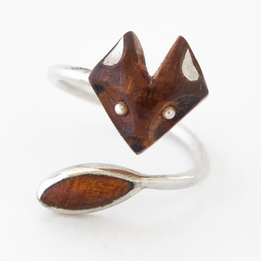 Adjustable silver ring with fox face and wooden tail.